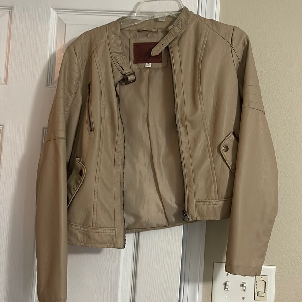 Tan leather jacket. New without tag